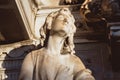 Statue of angel at cemetery. stoned angel praying in an old cemetery. Graveyard old crying angel sculpture on funeral. Death, loss Royalty Free Stock Photo