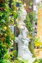 Statue of angel in cozy garden. Royalty Free Stock Photo