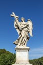 Statue of an Angel with the Cross by Ercole Ferrata on Sant`Angelo Bridge in Rome Royalty Free Stock Photo