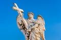 Statue of an Angel with the Cross on Sant`Angelo Bridge in Rome, Italy Royalty Free Stock Photo