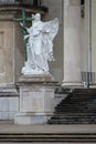 statue of an angel in front of a baroque church (karlskirche) in vienna (austria) Royalty Free Stock Photo