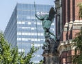 statue of an angel in front of the entrance to the church of st. michael in hamburg