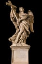 Statue of an angel holding a cross at Ponte Sant`Angelo, Rome Royalty Free Stock Photo