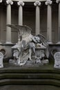 Statue of an angel lying on a tomb regretting the loss Royalty Free Stock Photo