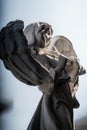 Statue of an angel playing violin in the garden Royalty Free Stock Photo