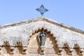 Statue of an angel on the roof of a building in the courtyard of Church of the Condemnation and Imposition of the Cross near the L