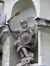 Statue of the angel Saint George with the flaming sword of the victorious dragon. Stone figure Royalty Free Stock Photo