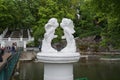 A statue of angels in love on the shore of Swan Lake in Kamyanets-Podolsk.