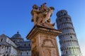 Statue of Angels near Leaning Tower and Cathedral of Pisa Royalty Free Stock Photo