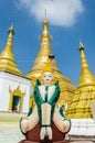 Myawaddy, Myanmar : Statue angle and pagoda.