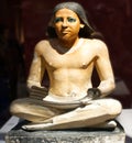 Statue of an anonymous seated Scribe. The Egyptian Museum in Cairo