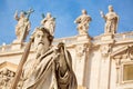 Statue of Apostle Paul with a sword in front of the St Peter`s Basilica, Rome, Italy during summer sunny day. Facade exterior in Royalty Free Stock Photo