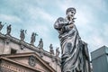 Statue of Apostle Peter in front of St Peter`s Basilica, Rome, Italy. Renaissance sculpture of apostle with key on dramatic sky Royalty Free Stock Photo