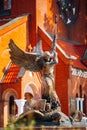 Statue Of Archangel Michael near Red Catholic Church Of St. Simo Royalty Free Stock Photo