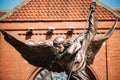 Statue Of Archangel Michael near Red Catholic Church Of St. Simon And St. Helena On Independence Square In Minsk Royalty Free Stock Photo