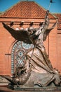 Statue Of Archangel Michael near Red Catholic Church Of St. Simon And St. Helena On Independence Square In Minsk Royalty Free Stock Photo