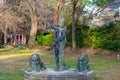 A Statue of an Archer With Two Lions