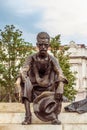 Statue of Atilla Jozsef in Budapest with the House of Parliamen Royalty Free Stock Photo