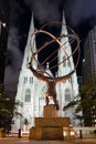 The Statue of Atlas and St Patrick Cathedral in New York at nigh