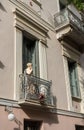 Statue on balcony of ancient residential district of Plaka in Athens Greece Royalty Free Stock Photo