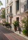 Statue on balcony of ancient residential district of Plaka in Athens Greece Royalty Free Stock Photo