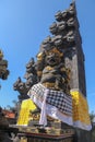 Statue of Balinese spirit guarding a Hindu temple Tanah Lot. Stone Statue guarding the gate to the temple on Bali island, Royalty Free Stock Photo