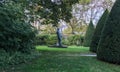 Statue of Balzac amongst sculpted trees on the Rodin Museum grounds Royalty Free Stock Photo