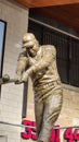 A statue of the baseball player Hank Aaron hitting a baseball inside of at Truist Park in Atlanta Georgia