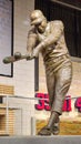 A statue of the baseball player Hank Aaron hitting a baseball inside of at Truist Park in Atlanta Georgia
