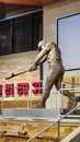 A statue of the baseball player Hank Aaron hitting a baseball inside of at Truist Park in Atlanta Georgia