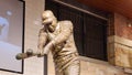 A statue of the baseball player Hank Aaron hitting a baseball inside of at Truist Park in Atlanta Georgia