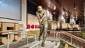 A statue of the baseball player Hank Aaron hitting a baseball inside of at Truist Park in Atlanta Georgia