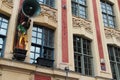 The statue of a bell-ringer and sculptured horns of plenty decorate the facade of a building in Lille (France)