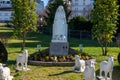 Statue of Bernadette of Lourdes with flowers