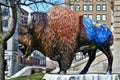 Statue of a bison covered with Indiana state national flag and red cardinal on the head sculpture