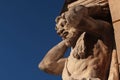 Statue of blacksmith Juraj Corgon, as Atlant supporting corner of bishop palace in Nitra, Slovakia.