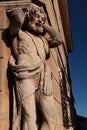 Statue of blacksmith Juraj Corgon, as Atlant supporting corner of bishop palace in Nitra, Slovakia.