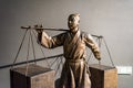 Statue of boy attendant to acient Chinese student of Ming Dynasty taking the luggages to the capital together to take the