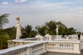 Statue of a boy and a girl with a light on its head, and view of Hyderabad, Falaknuma Palace, Hyderabad, Telangana, India