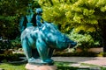 Statue of a boy riding a bear in the Frederik Meijer Gardens