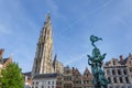 Statue of Brabo and the Cathedral of our Lady at Grand Place in Royalty Free Stock Photo