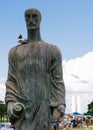 Statue in Brasilia, Brazil with Planalto government buildings in background