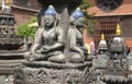 Statue of Buddha in front of small temple, Kathmandu, Nepal