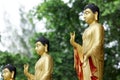 Statue of Buddha in golden standing position. Royalty Free Stock Photo
