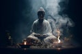 A statue of the Buddha and incense burning. Incense smoke in the dark atmosphere. Buddhism and its deities. Royalty Free Stock Photo