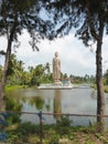 Statue of Buddha by lake