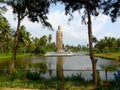 Statue of Buddha by lake