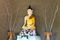 Statue of Buddha with rough cement wall. Royalty Free Stock Photo