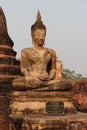 statue of buddha in a ruined buddhist temple (wat mahathat) in sukhothai (thailand)