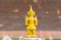 Statue of a buddhist godt, Louangphabang, Laos. Close-up. Copy space for text. Back view. Royalty Free Stock Photo